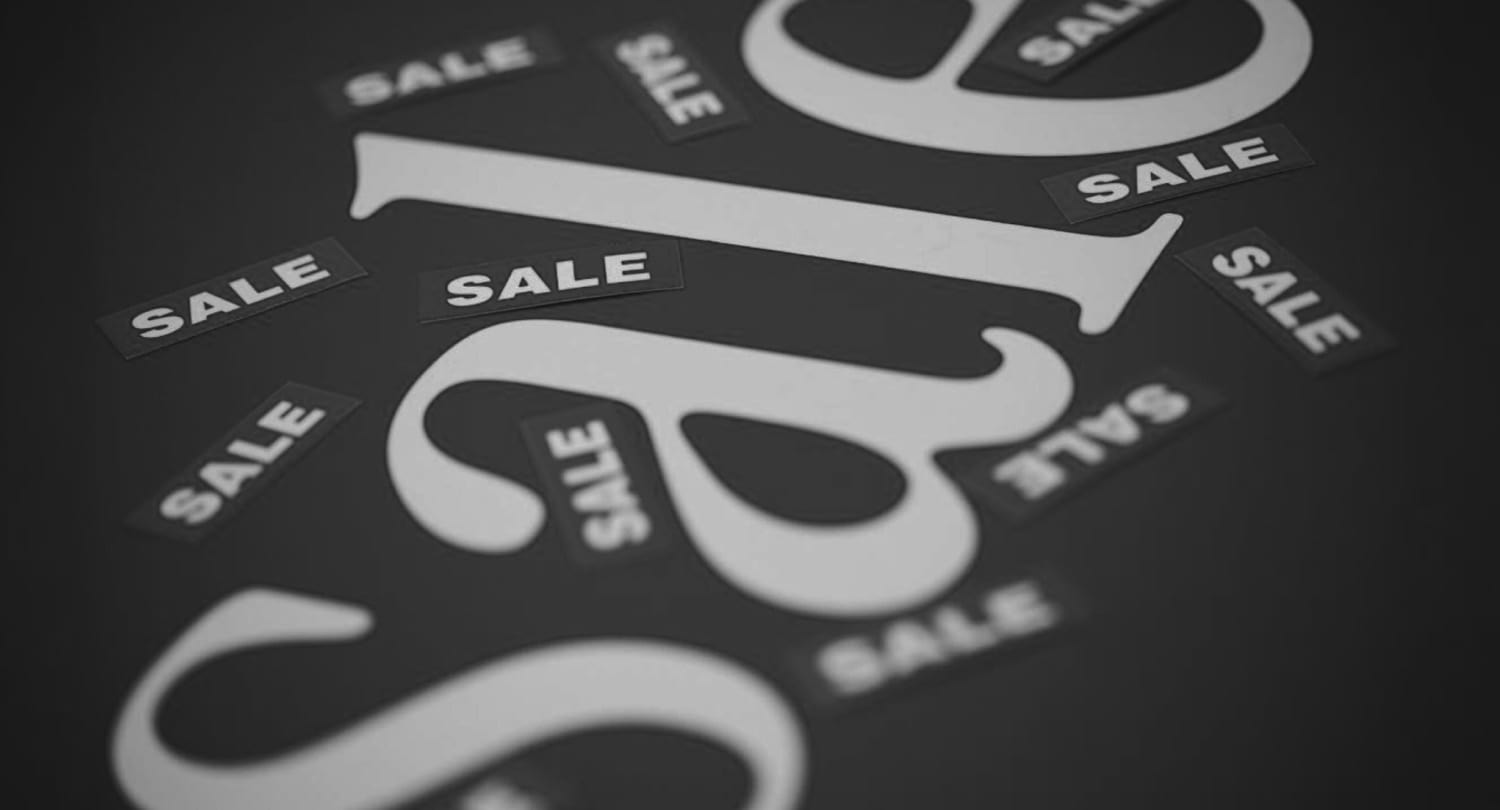 Business professional presenting pricing and sales strategies on a whiteboard, with hand-drawn bar and pie charts labeled with months and product categories.